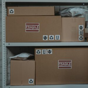 Brown Cardboard Boxes on Gray Steel Rack