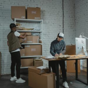 Man in White Shirt Standing Beside Woman in White Shirt